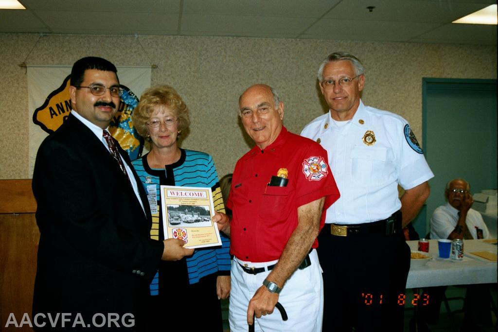 President John F. Long, Jr., County Executive Janet Owens, Al Brandt, Chief Roger Simmons. Convention Book Dedication to Al Brandt. Founder of the Anne Arundel Alarmers and the Anne Arundel County One Hundred Club