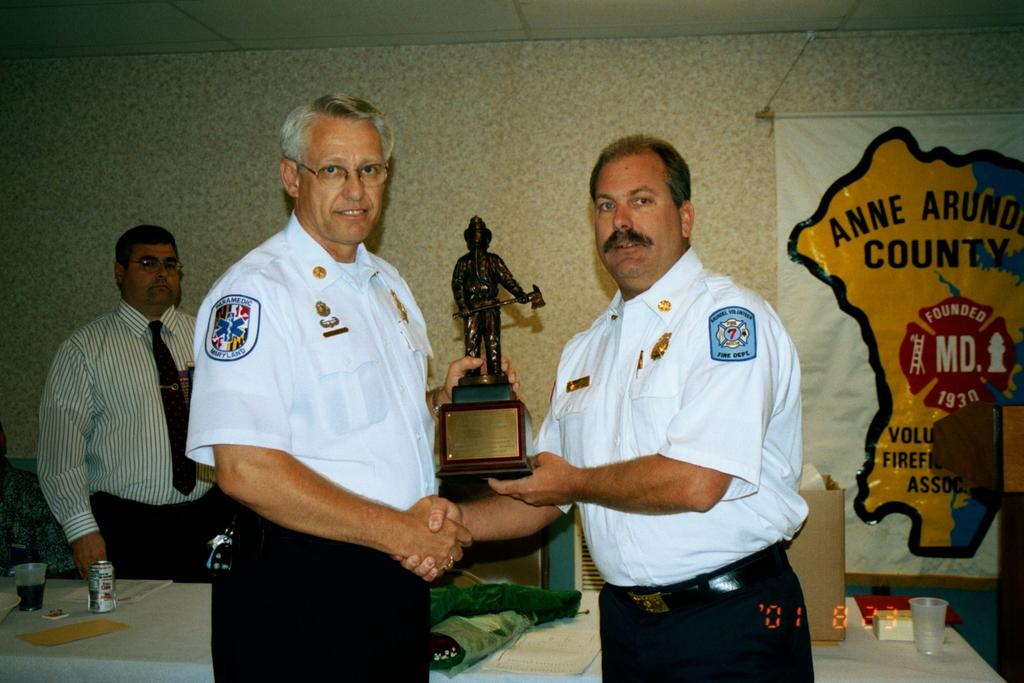 Anne Arundel County Fire Chief Roger Simmons presenting the Station Commander of the Year Award to Arundel VFD Chief Dave Ayers