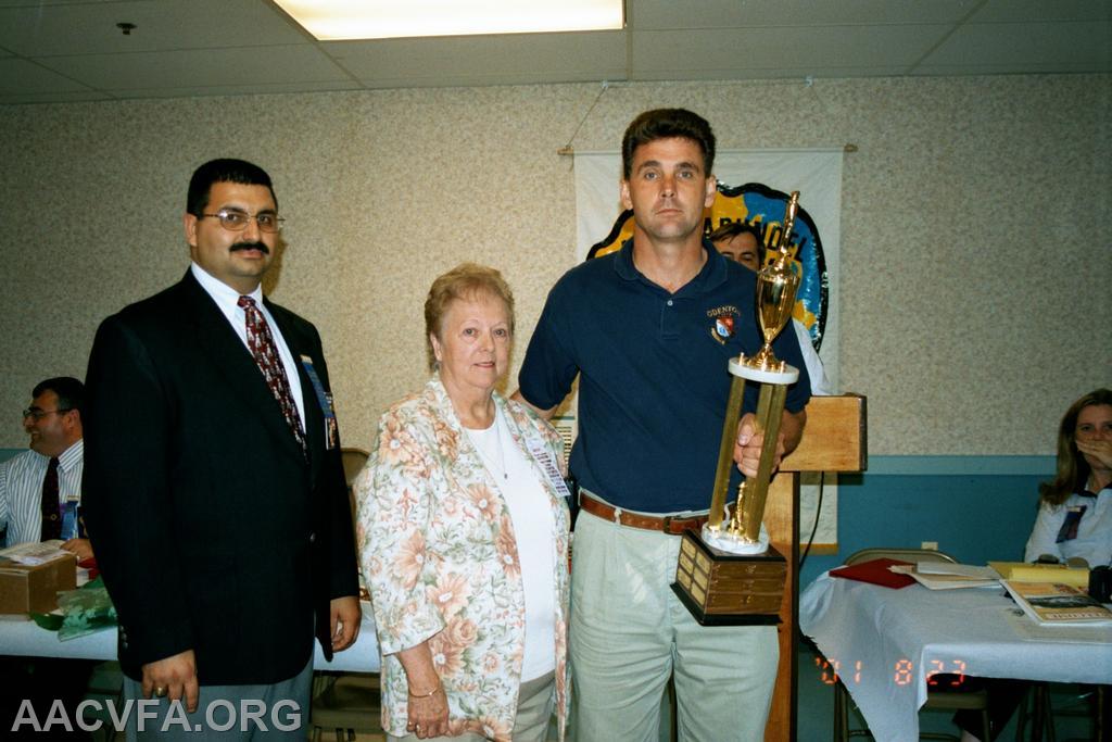 President John F. Long, Jr., Boot Raynor's widow, Odenton Chief Chuck Rogers. Jesse Fisher Award
