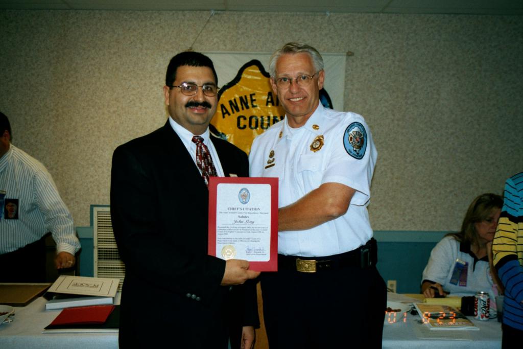 President John F. Long, Jr. receiving Chief Citation from Fire Chief Roger Simonds.